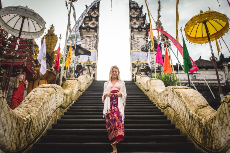 A woman at ancient gates in Pura Lempuyang ,Bali, Indonesia - Travel blogger exploring Bali landmarks